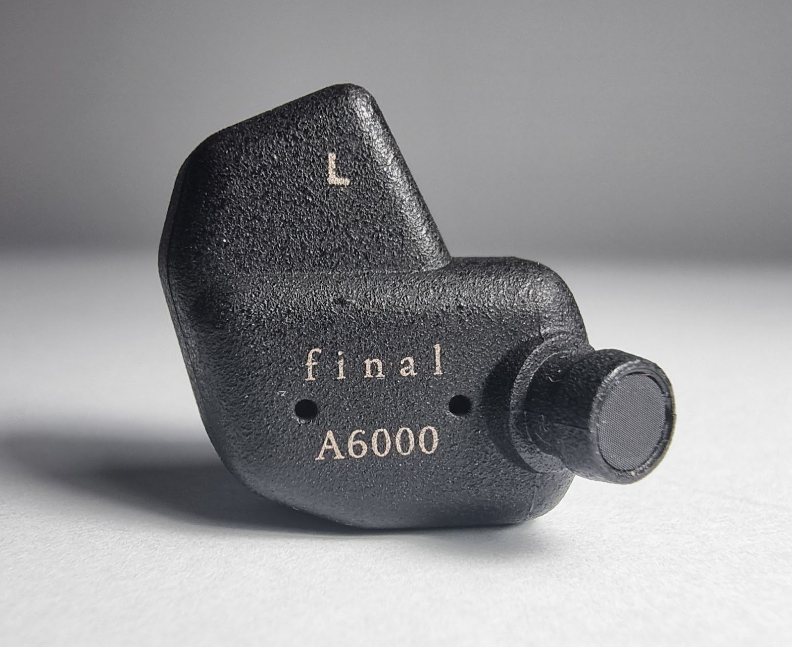 They are made of ABS plastic covered with metal spraying, which gives the surface an unusual texture with small irregularities and roughness. 