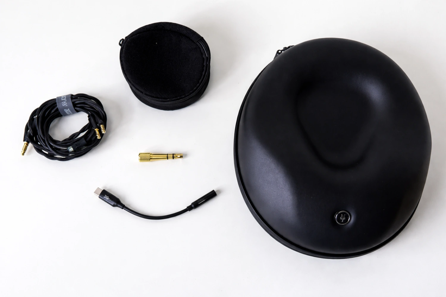 Meze includes a generous accessory package, including a protective travel case, detachable cable, and a compact USB-C DAC for modern devices.