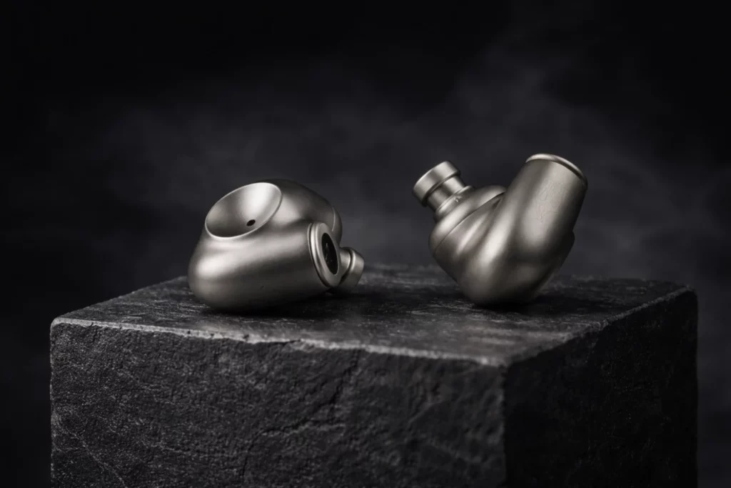 The Meze Audio Astru in-ear monitors feature a CNC-milled titanium shell, a 10mm dynamic driver with an 80-layer gold diaphragm, and a premium balanced cable—delivering flagship-level detail, imaging, and musical warmth for under $900.